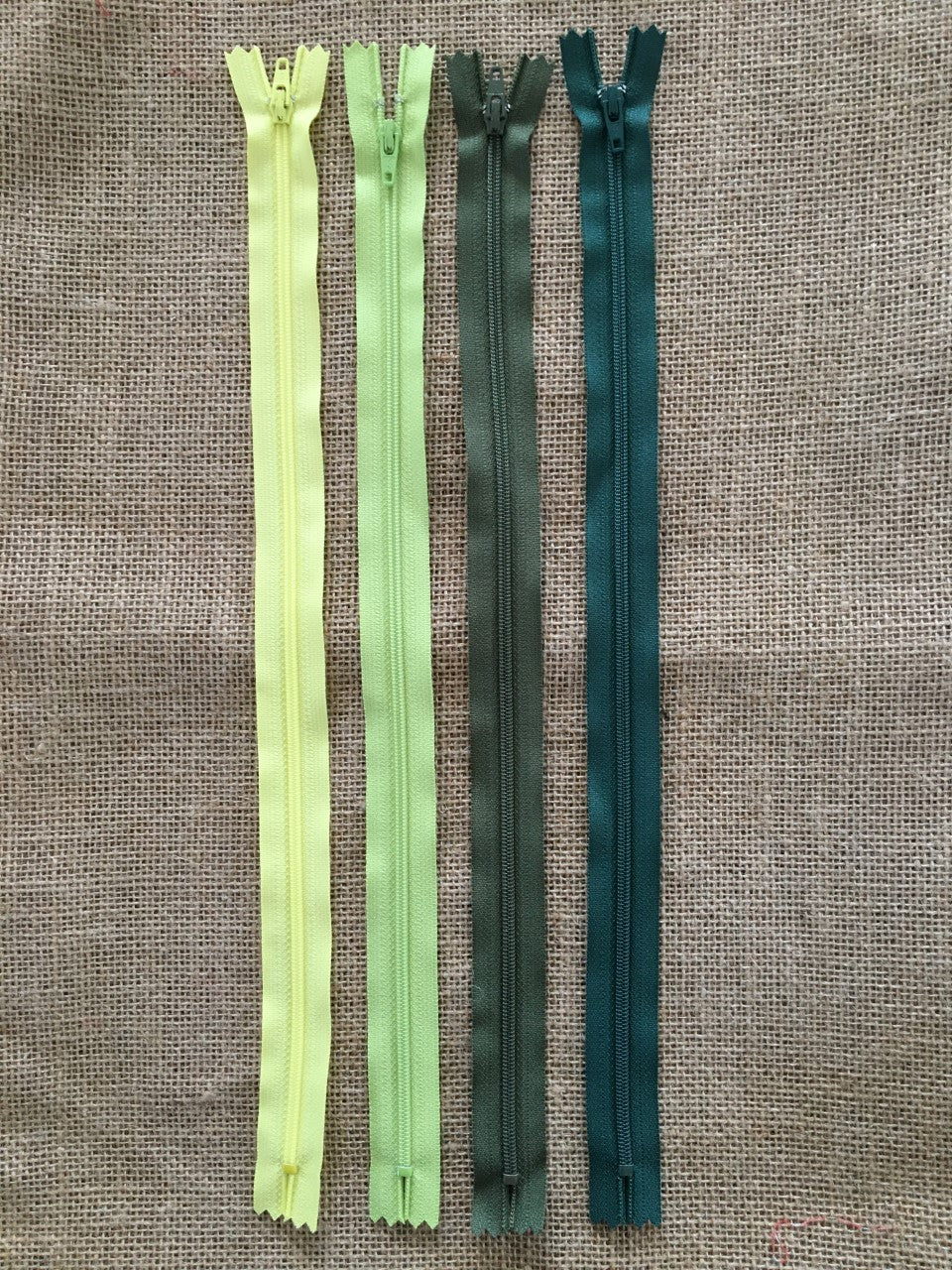 YKK 14 inch (35.5 cms) Closed End Nylon Zips - Size 3 Greens pack of four zippers